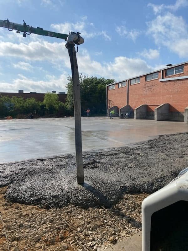 Boom pump placing concrete on a large commercial pour